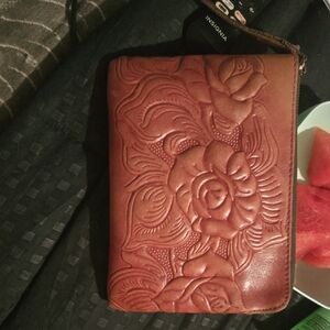 Embossed Floral Reddish Brown Wristlet By: Patricia Nash